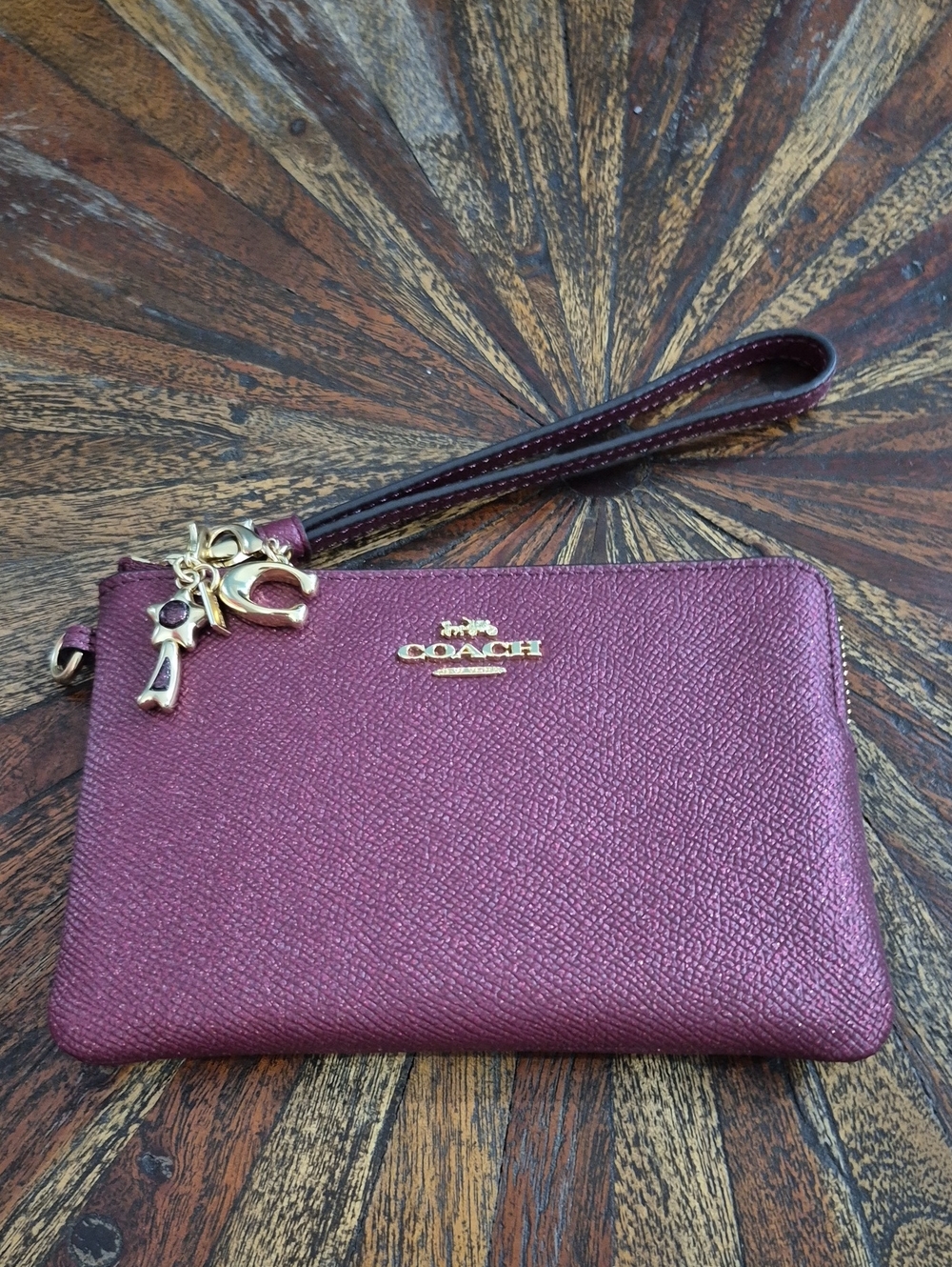Coach Metallic Plum Leather Wristlet with Gold Hardware. NWOT
